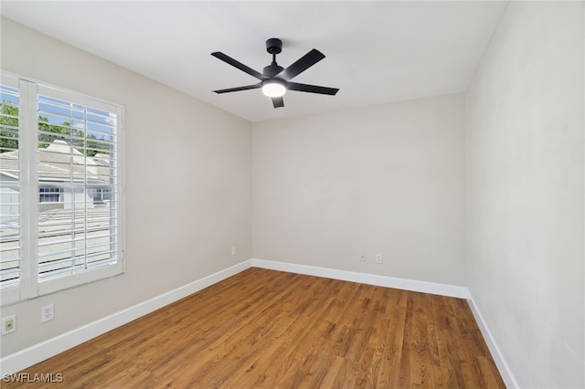 3770 Fieldstone Blvd Unit 1508, Naples, FL 34109 - unfurnished room with wood finished floors, baseboards, and a ceiling fan