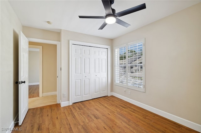 3770 Fieldstone Blvd Unit 1508, Naples, FL 34109 - unfurnished bedroom with a ceiling fan, baseboards, light wood-style floors, and a closet