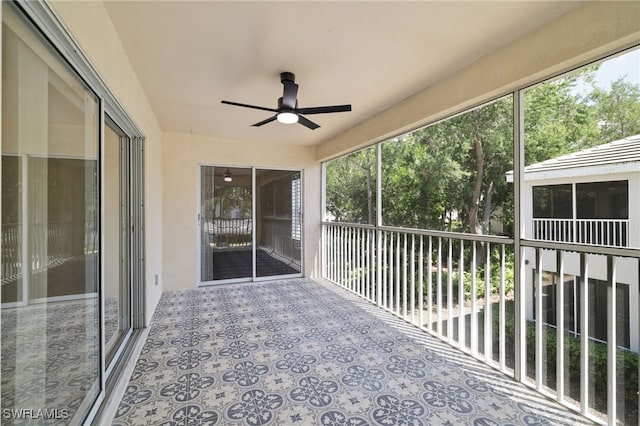 3770 Fieldstone Blvd Unit 1508, Naples, FL 34109 - unfurnished sunroom featuring a wealth of natural light and a ceiling fan