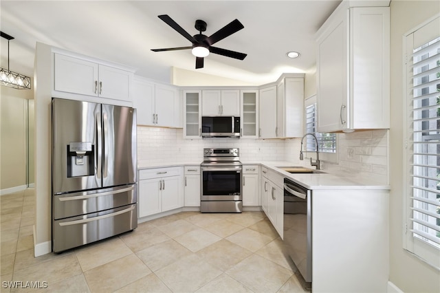 3770 Fieldstone Blvd Unit 1508, Naples, FL 34109 - kitchen with backsplash, ceiling fan, stainless steel appliances, and a sink