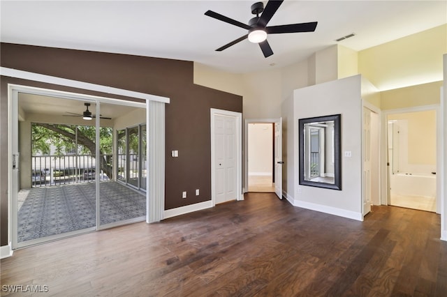 3770 Fieldstone Blvd Unit 1508, Naples, FL 34109 - unfurnished living room with lofted ceiling, wood finished floors, visible vents, baseboards, and ceiling fan