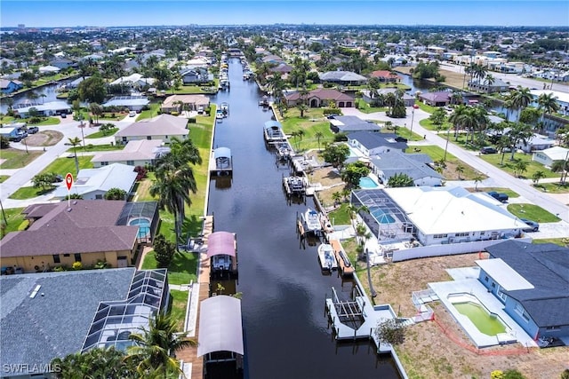 bird's eye view featuring a residential view and a water view
