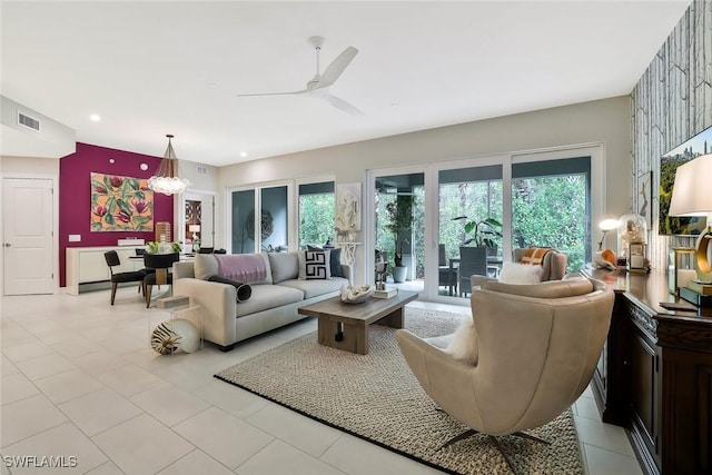 190 Indies Dr E Unit 102, Naples, FL 34114 - living area with a healthy amount of sunlight, light tile patterned floors, a ceiling fan, and visible vents