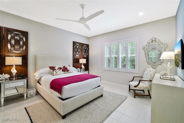 190 Indies Dr E Unit 102, Naples, FL 34114 - bedroom featuring light tile patterned floors, ceiling fan, and baseboards