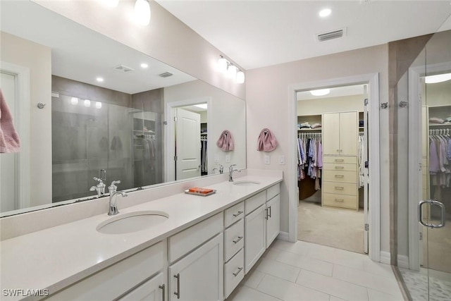 190 Indies Dr E Unit 102, Naples, FL 34114 - full bathroom with a sink, visible vents, and a shower stall