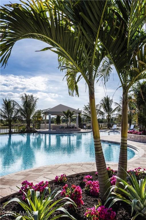 190 Indies Dr E Unit 102, Naples, FL 34114 - community pool featuring fence
