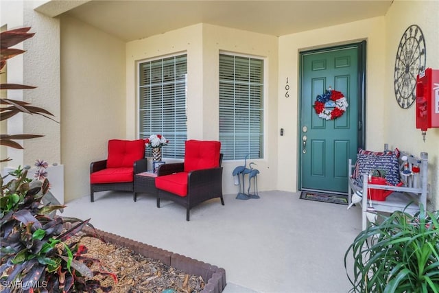doorway to property with stucco siding
