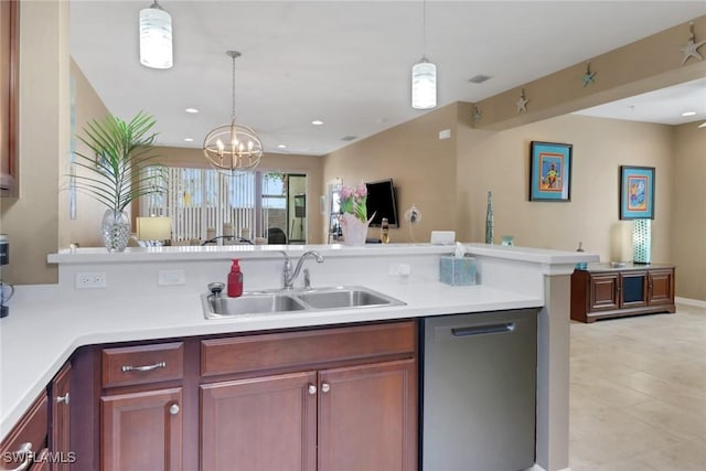 kitchen with open floor plan, dishwasher, light countertops, and a sink