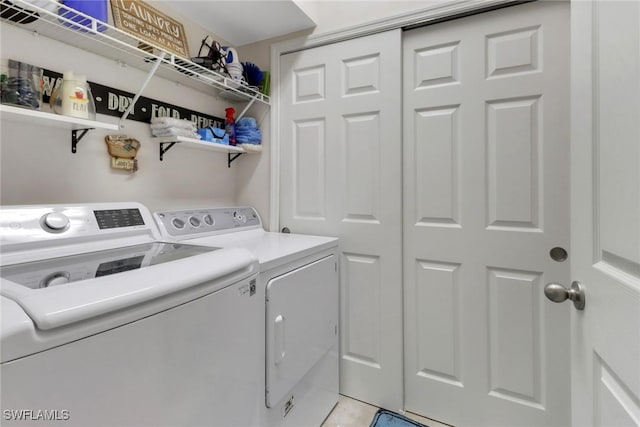 washroom featuring independent washer and dryer and laundry area