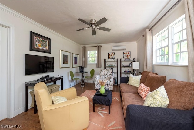 living room with a ceiling fan, a wall unit AC, a healthy amount of sunlight, and wood finished floors
