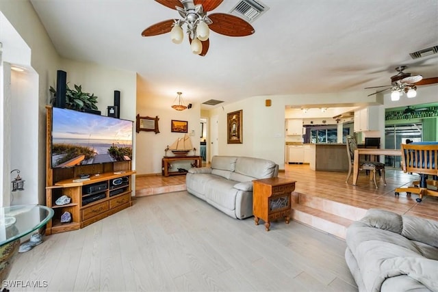 813 105th Ave N, Naples, FL 34108 - living room with a ceiling fan and light wood-type flooring