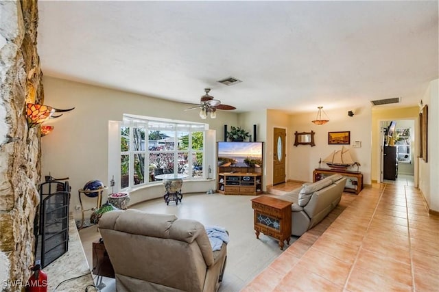 813 105th Ave N, Naples, FL 34108 - living room with ceiling fan and light tile patterned floors