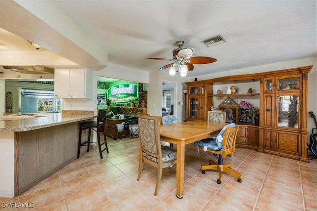 813 105th Ave N, Naples, FL 34108 - dining space with light tile patterned floors and a ceiling fan