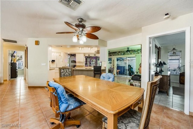 813 105th Ave N, Naples, FL 34108 - dining room with light tile patterned floors and a ceiling fan