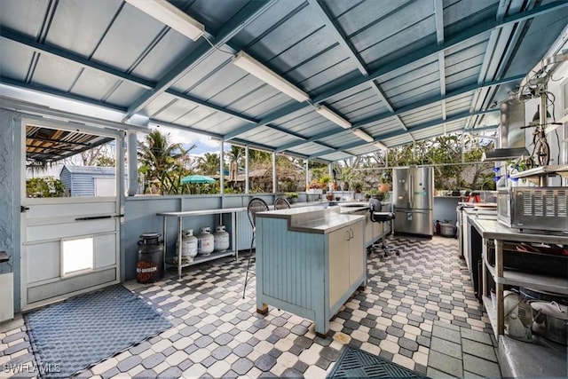 813 105th Ave N, Naples, FL 34108 - view of patio featuring exterior kitchen