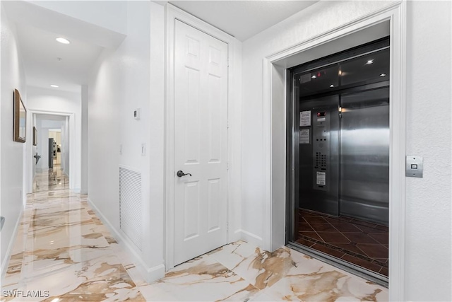 14356 Harbour Landings Dr Unit 6C, Fort Myers, FL 33908 - hallway with light marble finish flooring, elevator, baseboards, and recessed lighting