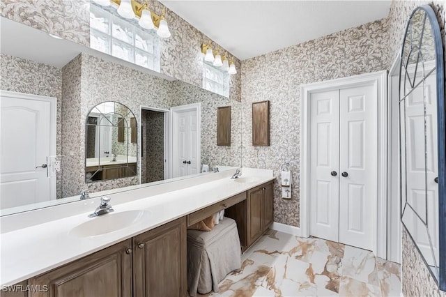 14356 Harbour Landings Dr Unit 6C, Fort Myers, FL 33908 - bathroom featuring a closet, wallpapered walls, and double vanity