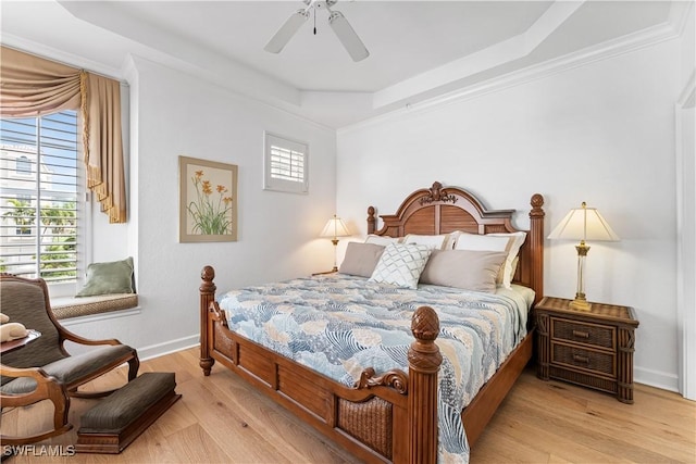 14356 Harbour Landings Dr Unit 6C, Fort Myers, FL 33908 - bedroom featuring a tray ceiling, light wood-type flooring, baseboards, and a ceiling fan