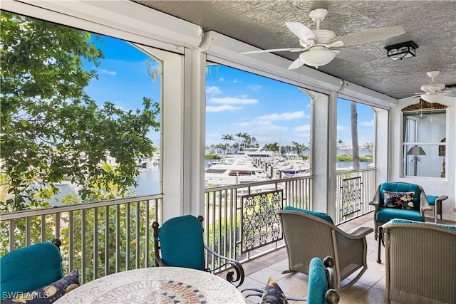14356 Harbour Landings Dr Unit 6C, Fort Myers, FL 33908 - sunroom / solarium featuring ceiling fan and a water view