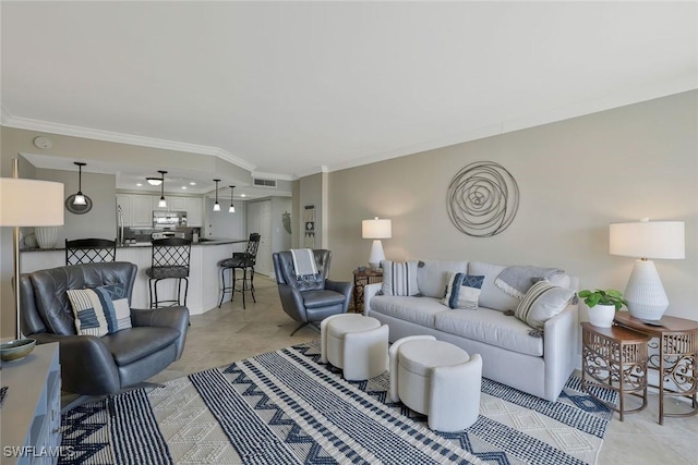 5 Bluebill Ave Unit 812, Naples, FL 34108 - living area with crown molding, visible vents, and light tile patterned floors