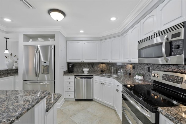 5 Bluebill Ave Unit 812, Naples, FL 34108 - kitchen featuring backsplash, a sink, ornamental molding, stainless steel appliances, and white cabinetry