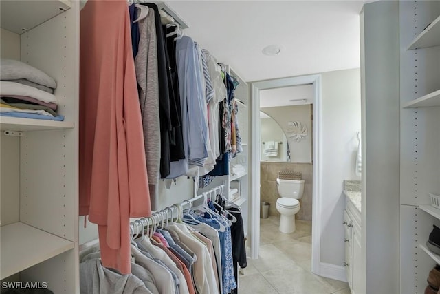 5 Bluebill Ave Unit 812, Naples, FL 34108 - walk in closet with light tile patterned floors