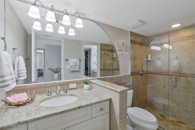 5 Bluebill Ave Unit 812, Naples, FL 34108 - bathroom with vanity, toilet, tile walls, a shower stall, and visible vents