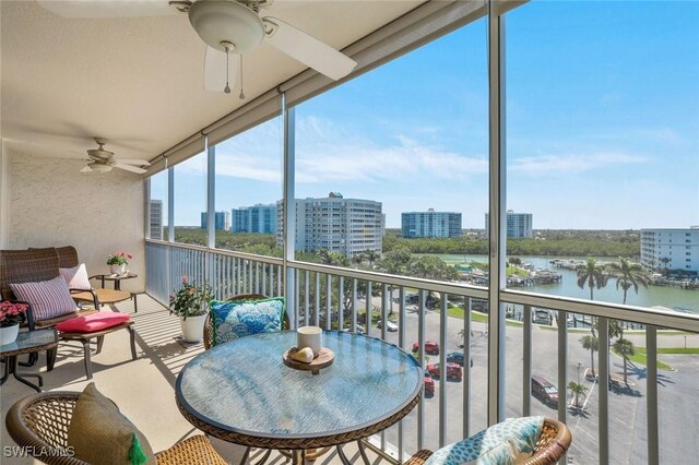 5 Bluebill Ave Unit 812, Naples, FL 34108 - balcony with a view of city, a water view, and a ceiling fan