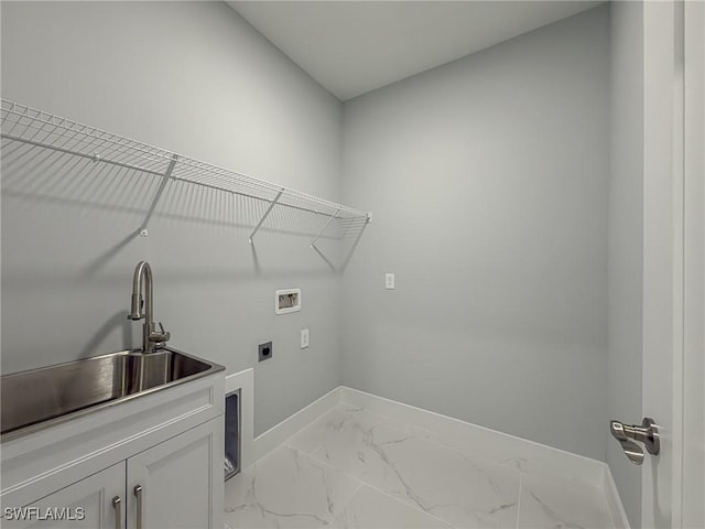 clothes washing area with cabinet space, washer hookup, a sink, marble finish floor, and baseboards