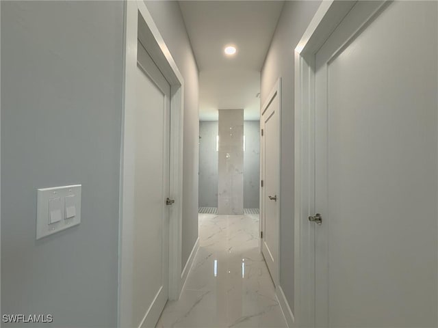 hall with recessed lighting, baseboards, and marble finish floor