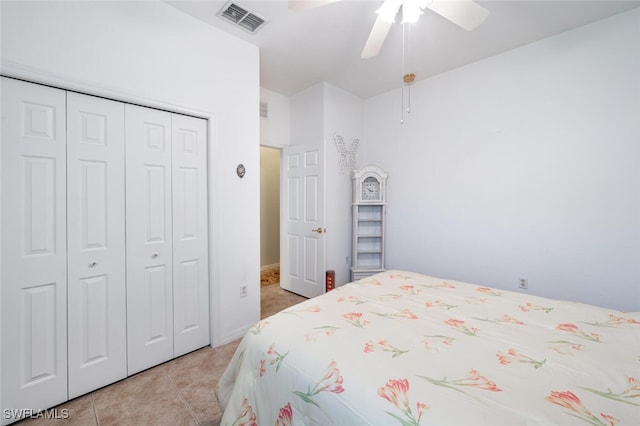 14194 Fall Creek Ct, Naples, FL 34114 - bedroom with a closet, light tile patterned flooring, and ceiling fan