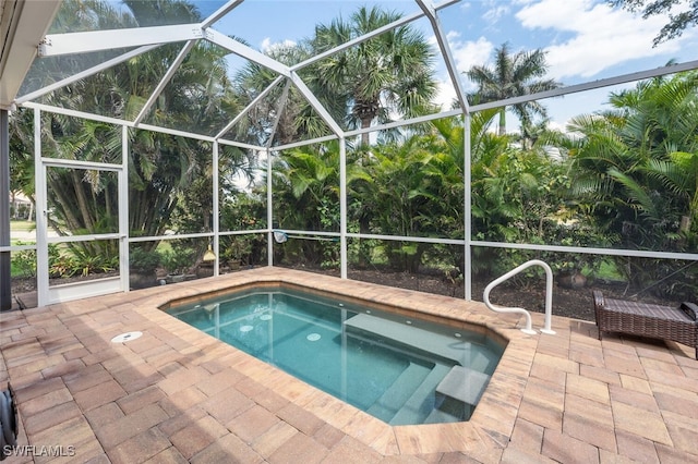 14194 Fall Creek Ct, Naples, FL 34114 - view of pool with a patio, glass enclosure, and a hot tub