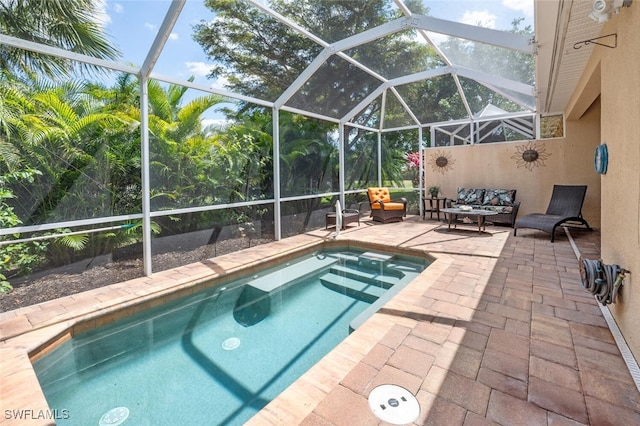 14194 Fall Creek Ct, Naples, FL 34114 - outdoor pool featuring a patio, an outdoor hangout area, and glass enclosure