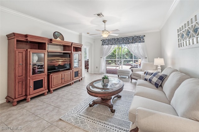 14194 Fall Creek Ct, Naples, FL 34114 - living room with light tile patterned floors, ornamental molding, ceiling fan, and baseboards