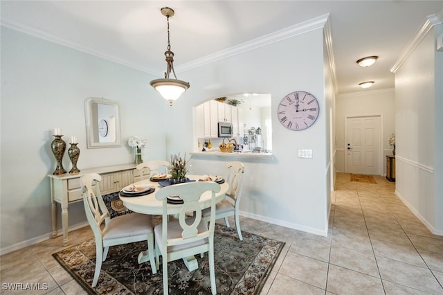 14194 Fall Creek Ct, Naples, FL 34114 - dining area featuring crown molding, light tile patterned floors, and baseboards