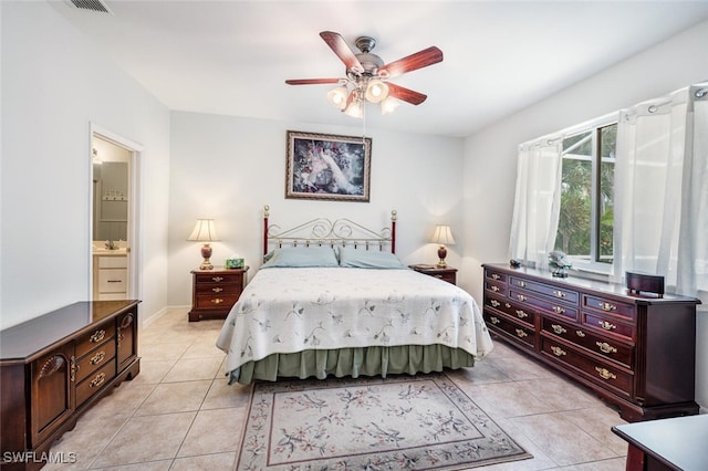 14194 Fall Creek Ct, Naples, FL 34114 - bedroom featuring light tile patterned flooring, ceiling fan, and ensuite bathroom