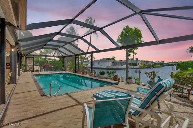 4607 SW 5th Pl, Cape Coral, FL 33914 - swimming pool featuring a patio, a water view, and glass enclosure