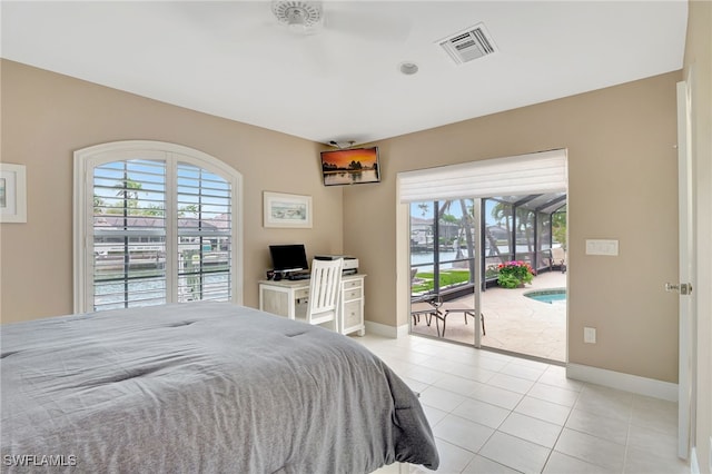 bedroom with light tile patterned floors, visible vents, access to exterior, and baseboards