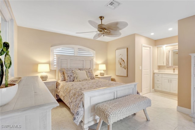 bedroom featuring ceiling fan, visible vents, ensuite bathroom, baseboards, and recessed lighting
