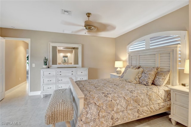 bedroom with baseboards, visible vents, a ceiling fan, and light tile patterned flooring