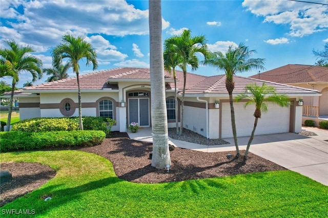 view of front of property featuring a tile roof, driveway, an attached garage, and stucco siding