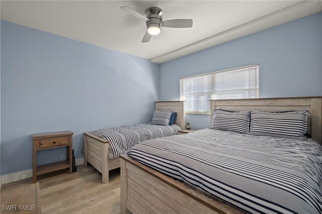 bedroom featuring a ceiling fan and light wood finished floors