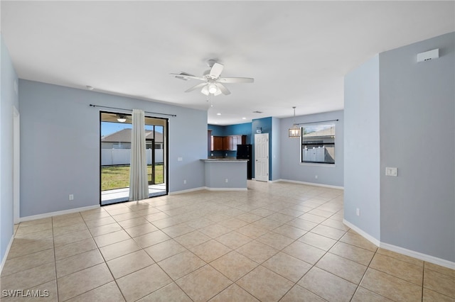 1322 SW 22nd Ave, Cape Coral, FL 33991 - unfurnished living room with recessed lighting, ceiling fan, baseboards, and light tile patterned floors