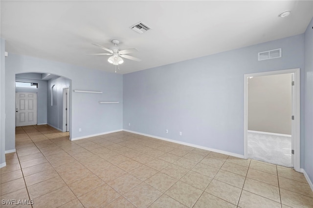 1322 SW 22nd Ave, Cape Coral, FL 33991 - spare room with arched walkways, visible vents, ceiling fan, and light tile patterned floors