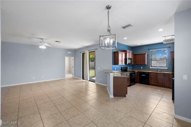 1322 SW 22nd Ave, Cape Coral, FL 33991 - kitchen featuring black appliances, a healthy amount of sunlight, a sink, and light tile patterned floors