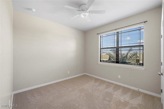 1322 SW 22nd Ave, Cape Coral, FL 33991 - empty room featuring a ceiling fan, baseboards, and carpet