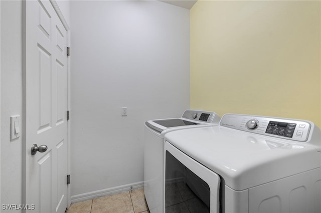 1322 SW 22nd Ave, Cape Coral, FL 33991 - clothes washing area with light tile patterned floors, baseboards, laundry area, and independent washer and dryer