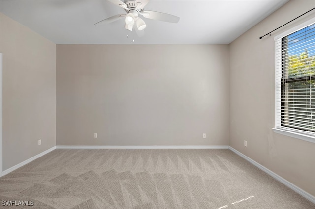 1322 SW 22nd Ave, Cape Coral, FL 33991 - spare room with carpet floors, a ceiling fan, and baseboards