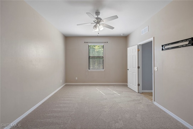 1322 SW 22nd Ave, Cape Coral, FL 33991 - empty room featuring ceiling fan, light carpet, visible vents, and baseboards