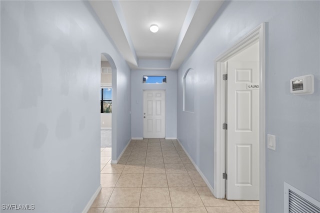 1322 SW 22nd Ave, Cape Coral, FL 33991 - corridor with arched walkways, visible vents, baseboards, and light tile patterned floors